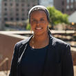 Photo of staff member Hawa Yusuf with a black blazer and shirt
